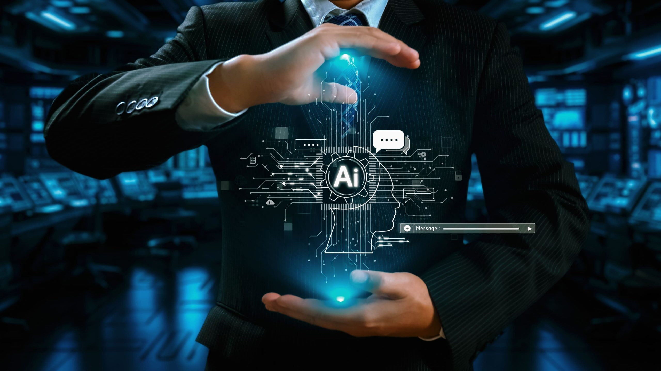 Business professional in a dark suit holding a glowing digital AI interface, symbolizing how business leaders design and control artificial intelligence strategy for transformation.